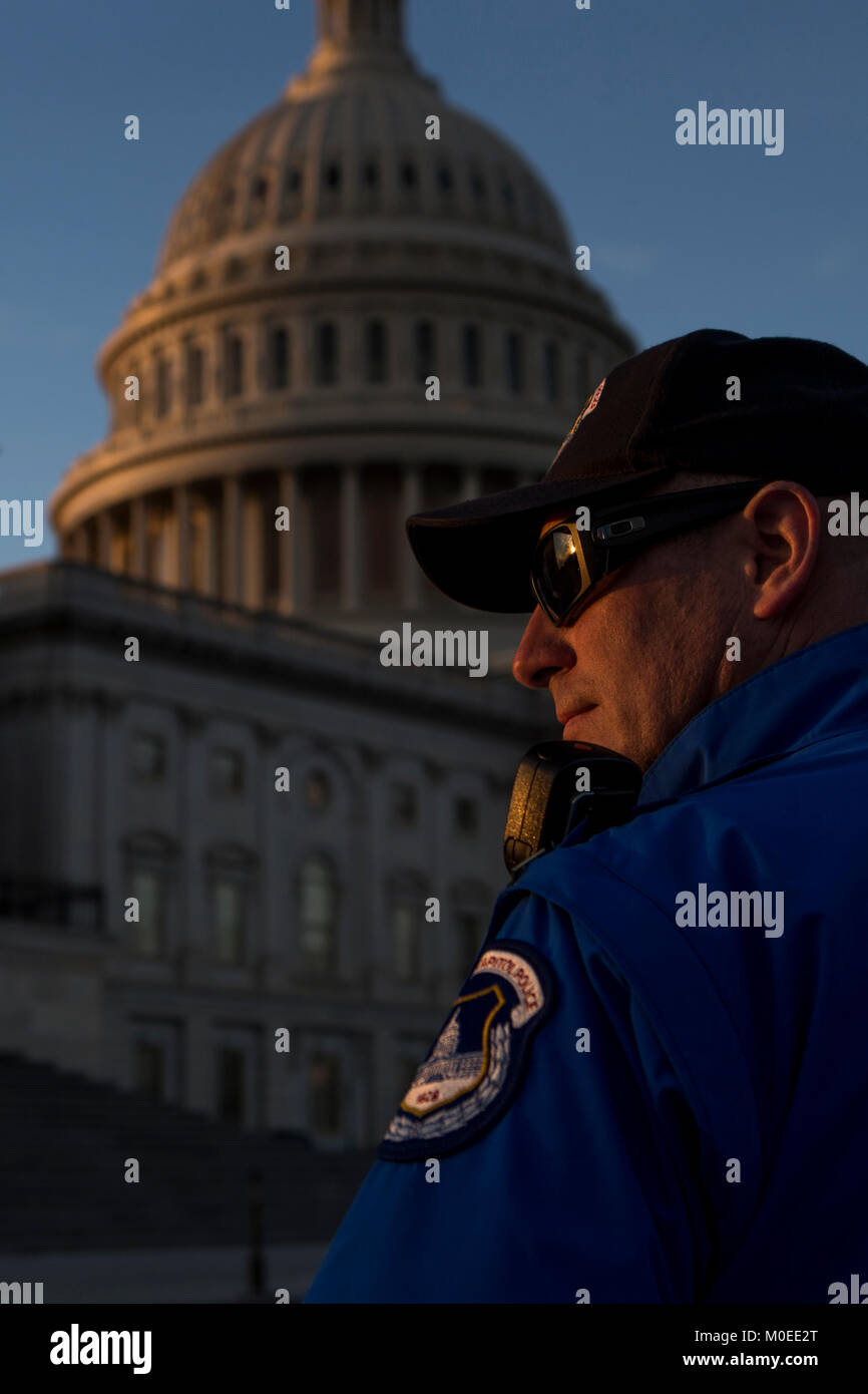 As a police officer stands outside the service hi-res stock photography ...