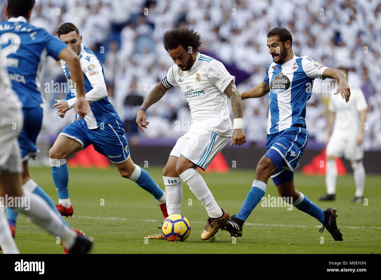 Madrid, Madrid, Spain. 21st Jan, 2018. Real Madrid player Marcelo competes for the ball with Deportivo de la CoruÃ±a player Celso Borges during the match.Real Madrid faced Deportivo de la CoruÃ±a at the Santiago Bernabeu stadium during the Spanish league game ''La Liga''. Final score Real Madrid won 7-1. Credit: Manu Reino/SOPA/ZUMA Wire/Alamy Live News Stock Photo