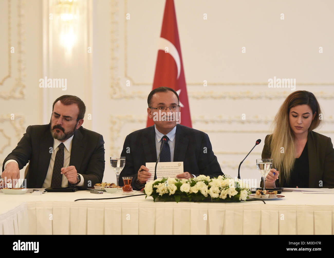 Istanbul, Turkey. 21st Jan, 2018. Turkish Deputy Prime Minister Bekir Bozdag (C) answers a question at a press conference in Istanbul, Turkey, on Jan. 21, 2018. Turkish President Recep Tayyip Erdogan on Sunday voiced hope for the ongoing military operation against Kurdish militia in Syria's Afrin to end 'in a very short time.' Turkish Deputy Prime Minister Bekir Bozdag said the operation will continue until 'all the terror elements are removed,' which he said include the PKK, YPG and the Islamic State. Credit: He Canling/Xinhua/Alamy Live News Stock Photo