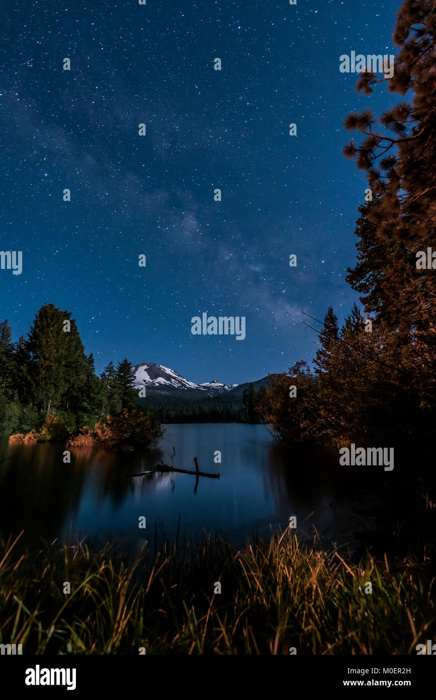 Stars and Milky Way Over Manzanita Lake with Lassen Peak Stock Photo