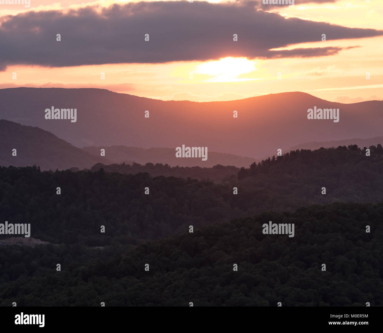 Sun Begins to Set Below Blue Ridge Mountain Ridges Stock Photo