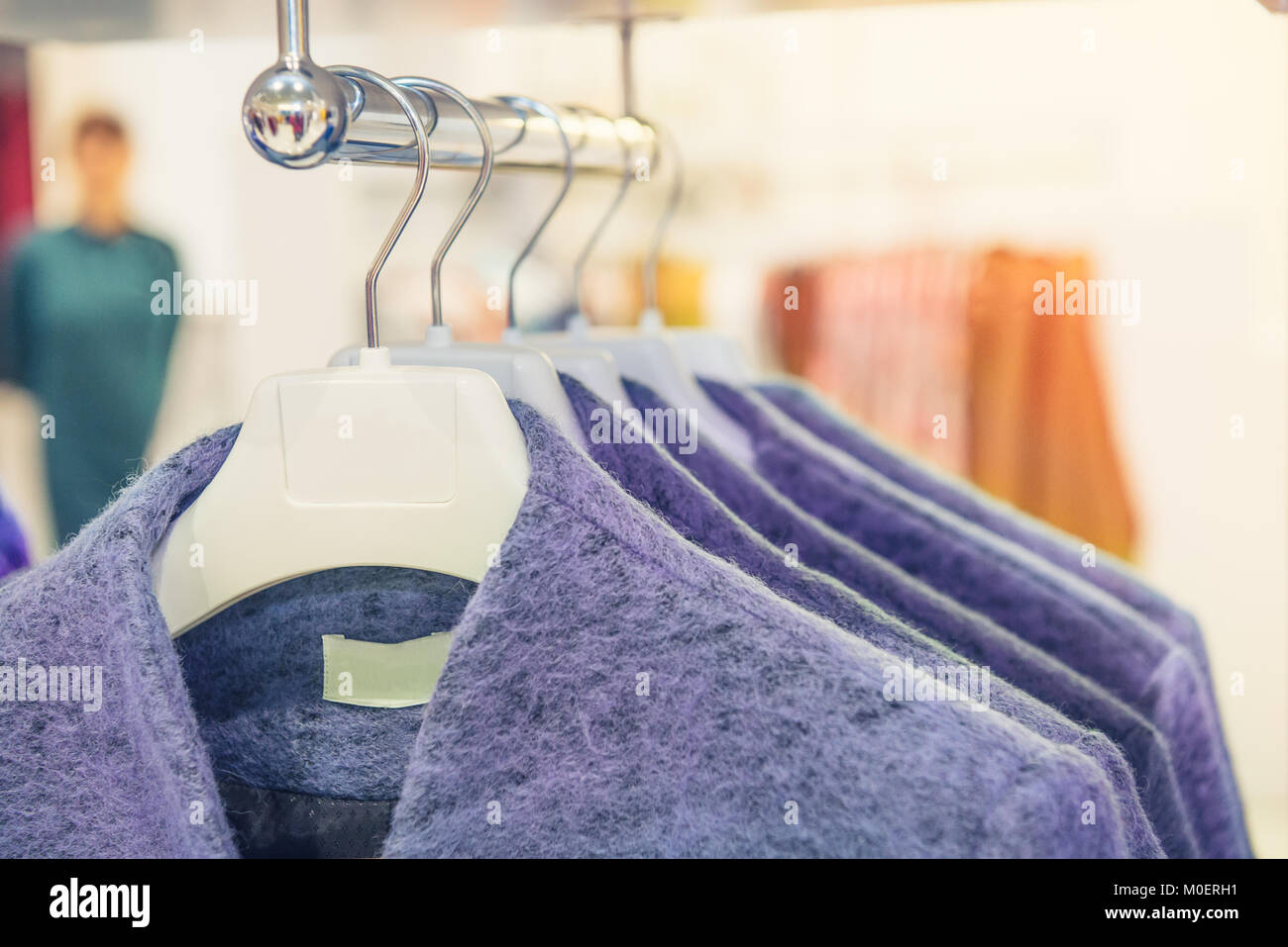 Hanging up coats hi-res stock photography and images - Alamy
