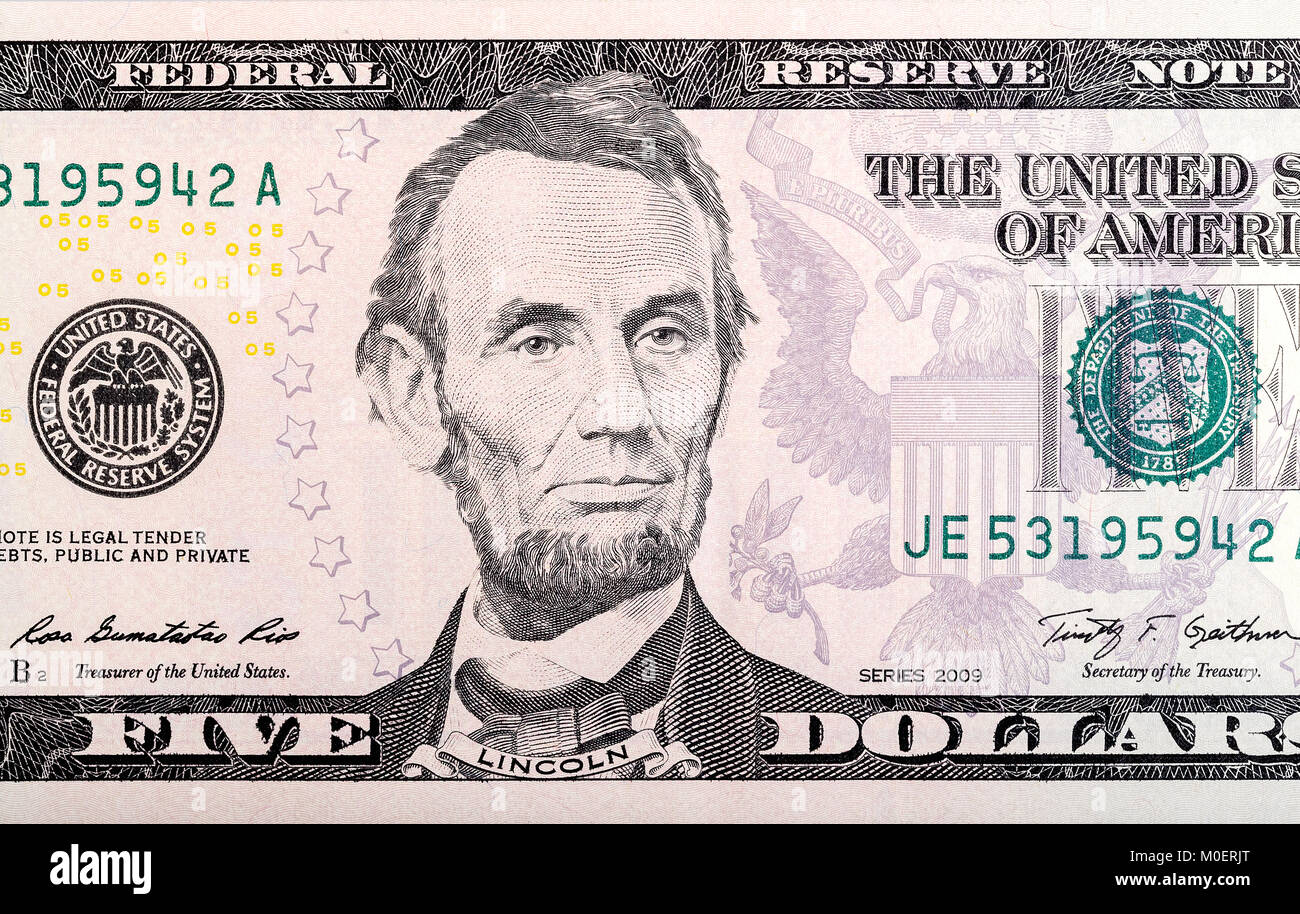 Abraham Lincoln on five dollar bill. Stock Photo