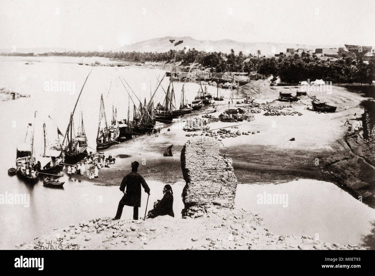 Boats on the Nile at Assouan (Aswan), Egypt 1857. It seems probable that the figure mid-frame is Frith himself. Stock Photo