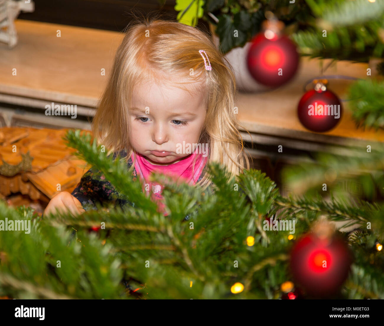 Decorating a Christmas tree Stock Photo - Alamy