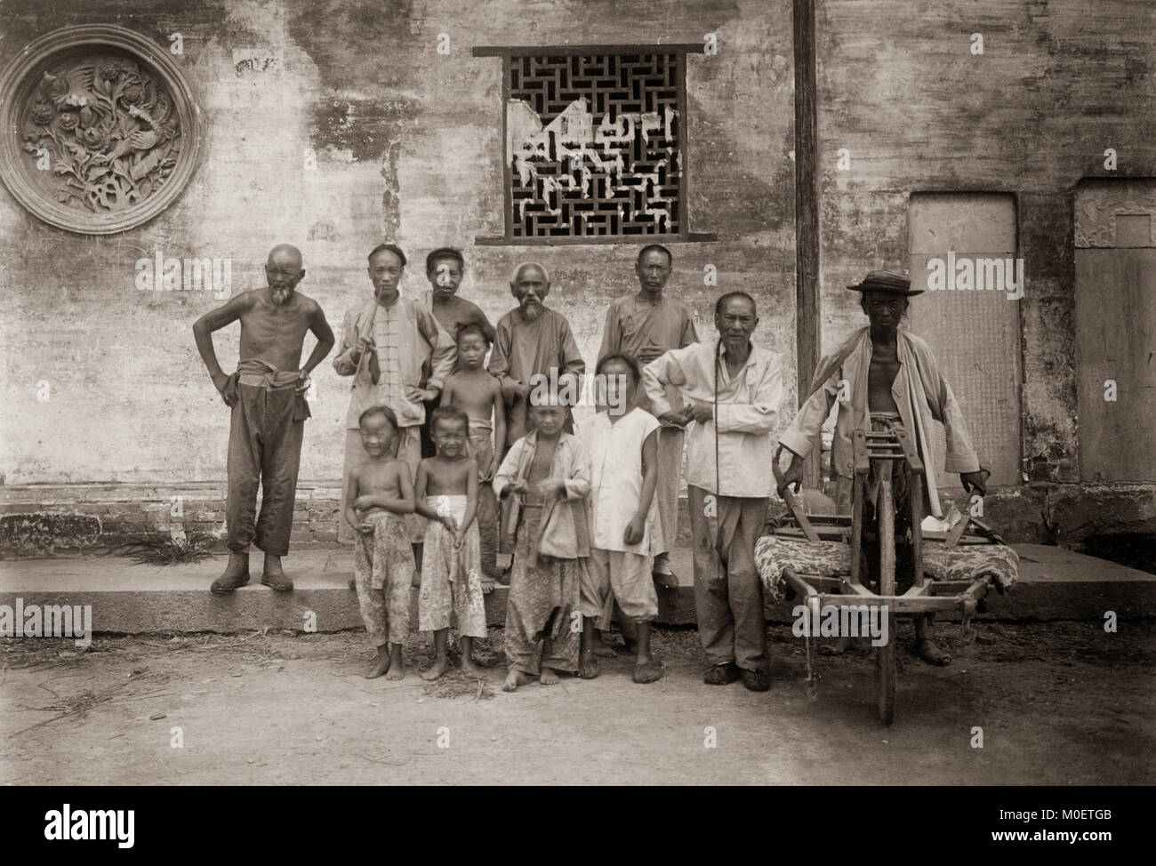 Street hawker/vendor with wheelbarrow, China c.1900 Stock Photo Alamy