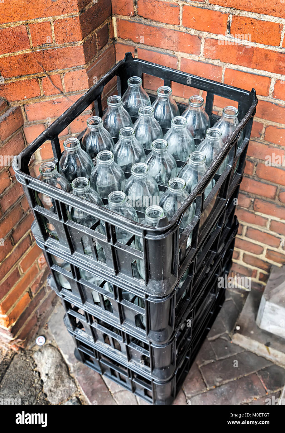 Milk bottles in crates, RGS, London, UK Stock Photo