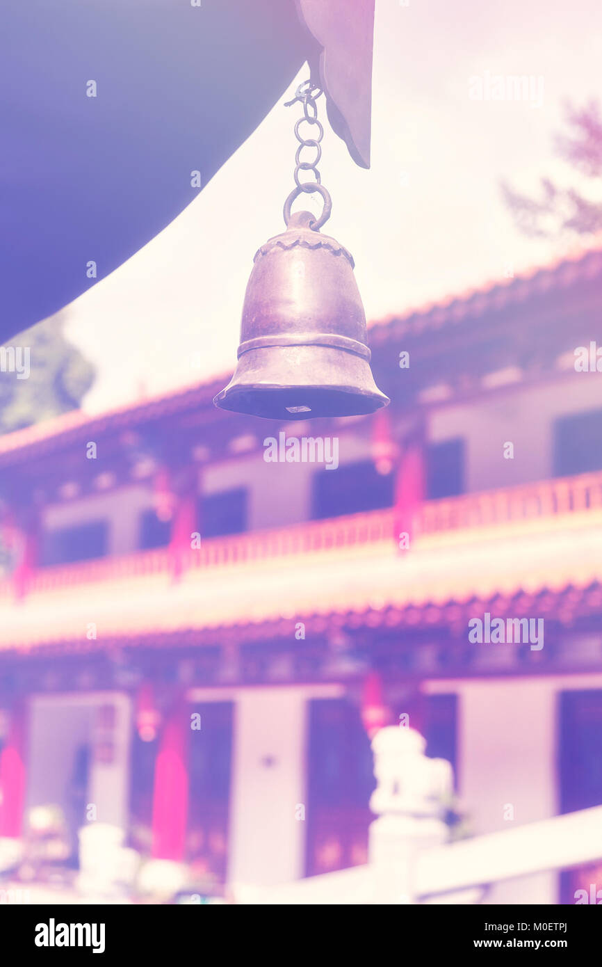 Color toned picture of a temple bell, selective focus, China. Stock Photo