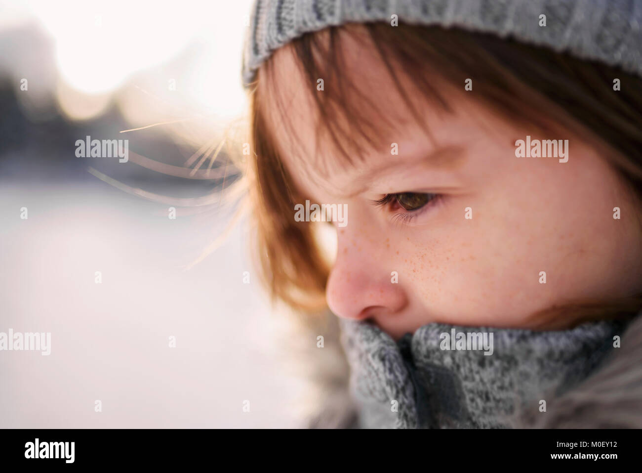 Close-up portrait of a girl outside wearing warm clothing Stock Photo