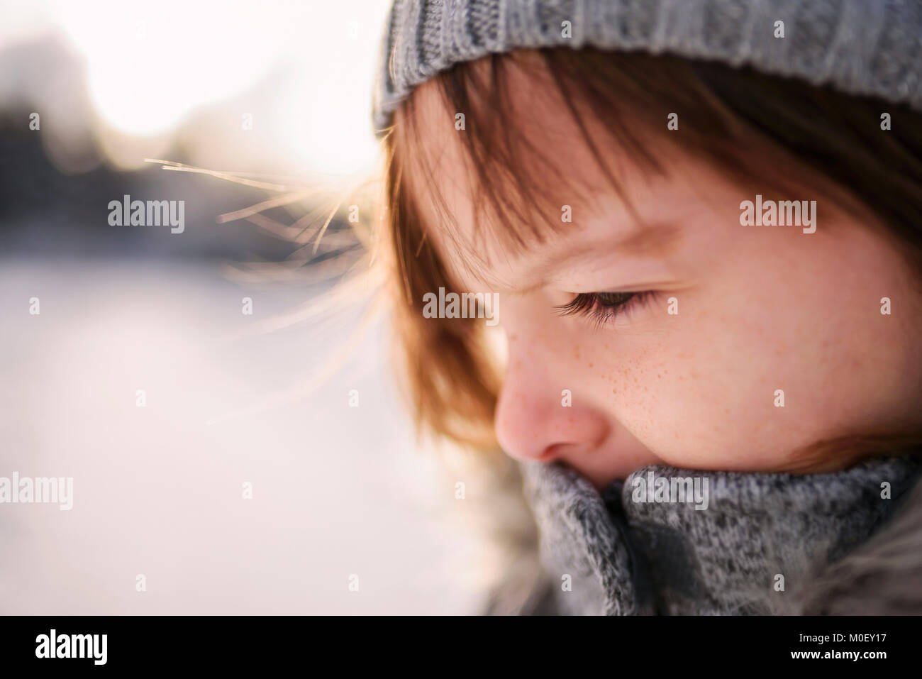 Close-up portrait of a girl outside wearing warm clothing Stock Photo