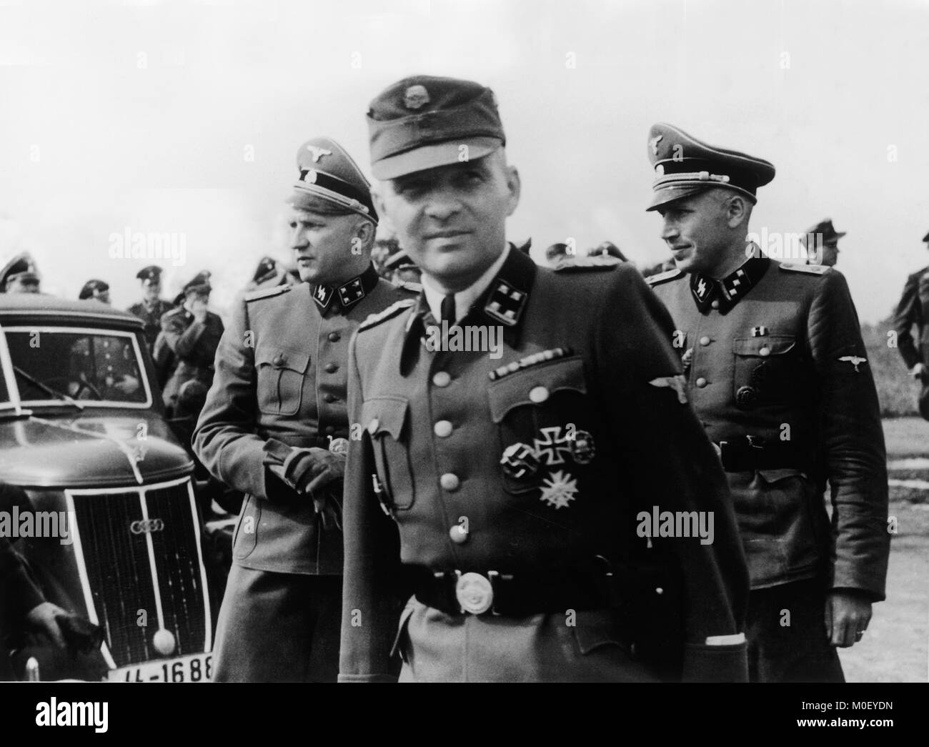 Rudolf Hoss, Commondant pictured at Auschwitz Concentration Camp during World War Two. Rudolf Höss (also Höß, Hoeß or Hoess; 25 November 1901 – 16 April 1947) was a Nazi German SS-Obersturmbannführer (lieutenant colonel) and the longest-serving commandant of Auschwitz concentration and extermination camp in World War II. He tested and carried into effect various methods to accelerate Hitler's plan to systematically exterminate the Jewish population of Nazi-occupied Europe, known as the Final Solution. Stock Photo