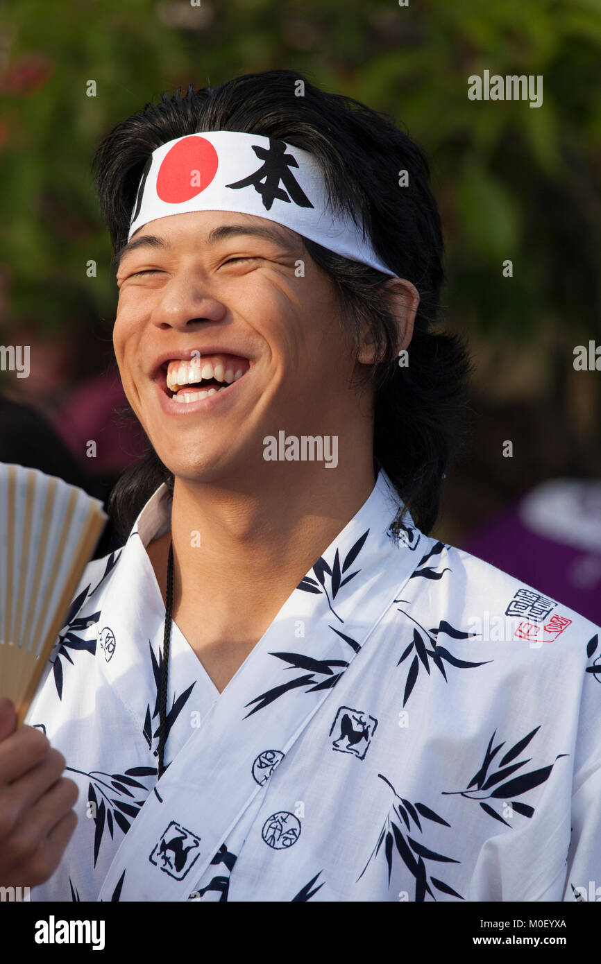 Japanese man in costume smiling broadly Stock Photo