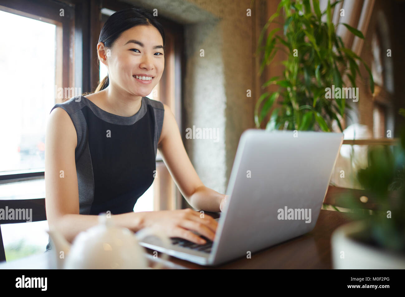 Woman with laptop Stock Photo