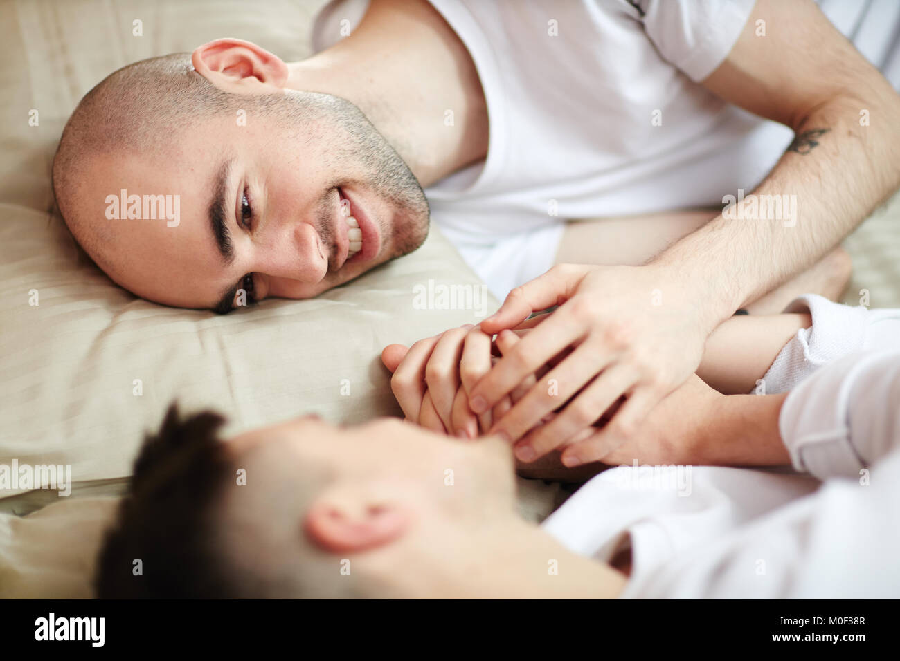 Men in bed Stock Photo