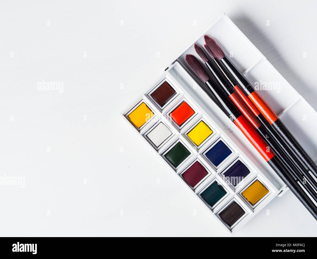 Watercolor godets and brushes on white - a Royalty Free Stock Photo from  Photocase