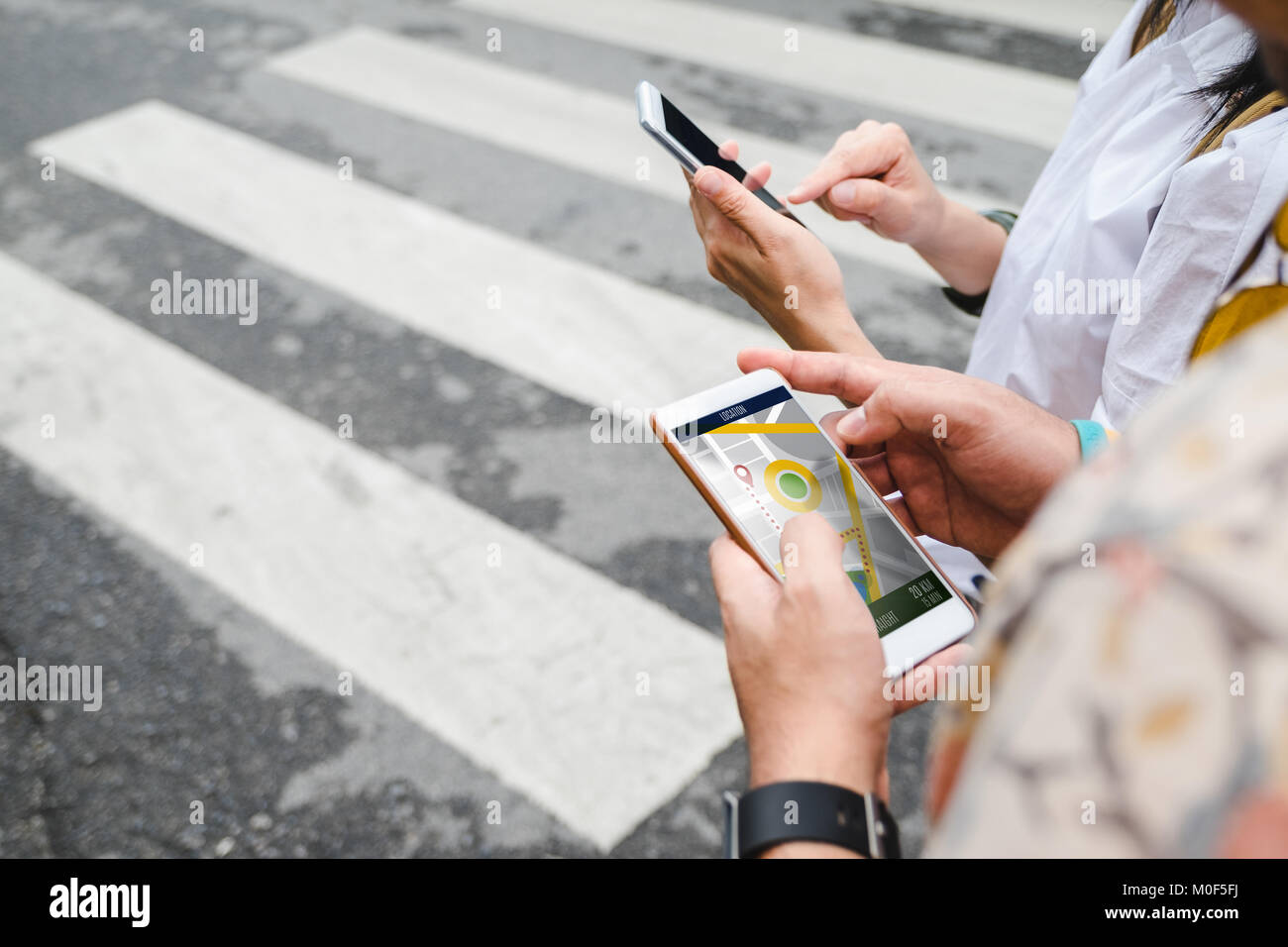 Traveler use map on mobile phone app to search for route location of ...