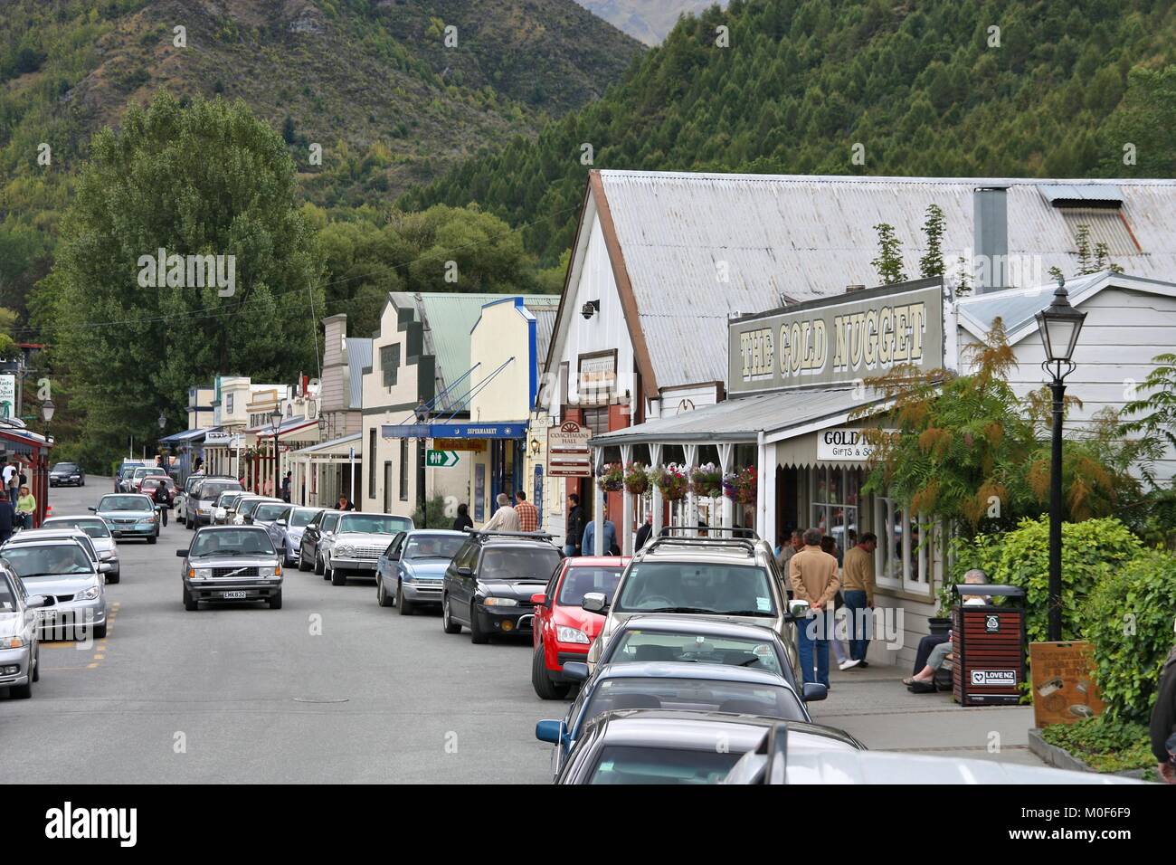 ARROWTOWN, NEW ZEALAND - FEBRUARY 28, 2009: People visit Arrowtown in New Zealand. Arrowtown is a historic gold mining town in the Otago region Stock Photo