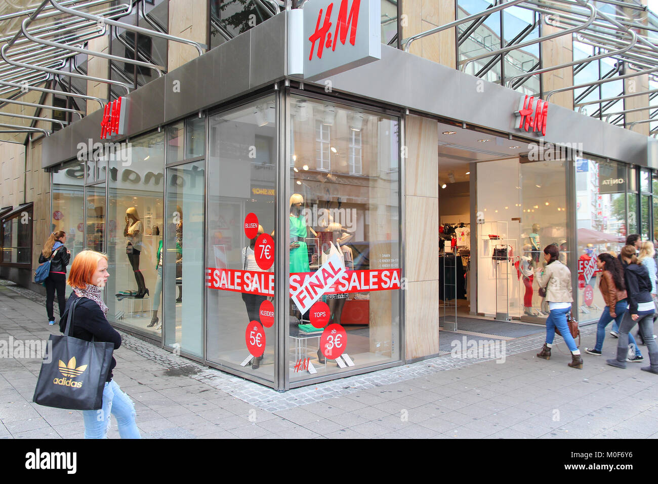 ESSEN, GERMANY - JULY 17: People visit H&M on July 17, 2012 in Essen. H&M  is an international fashion retail corporation known for its fast fashion  ap Stock Photo - Alamy