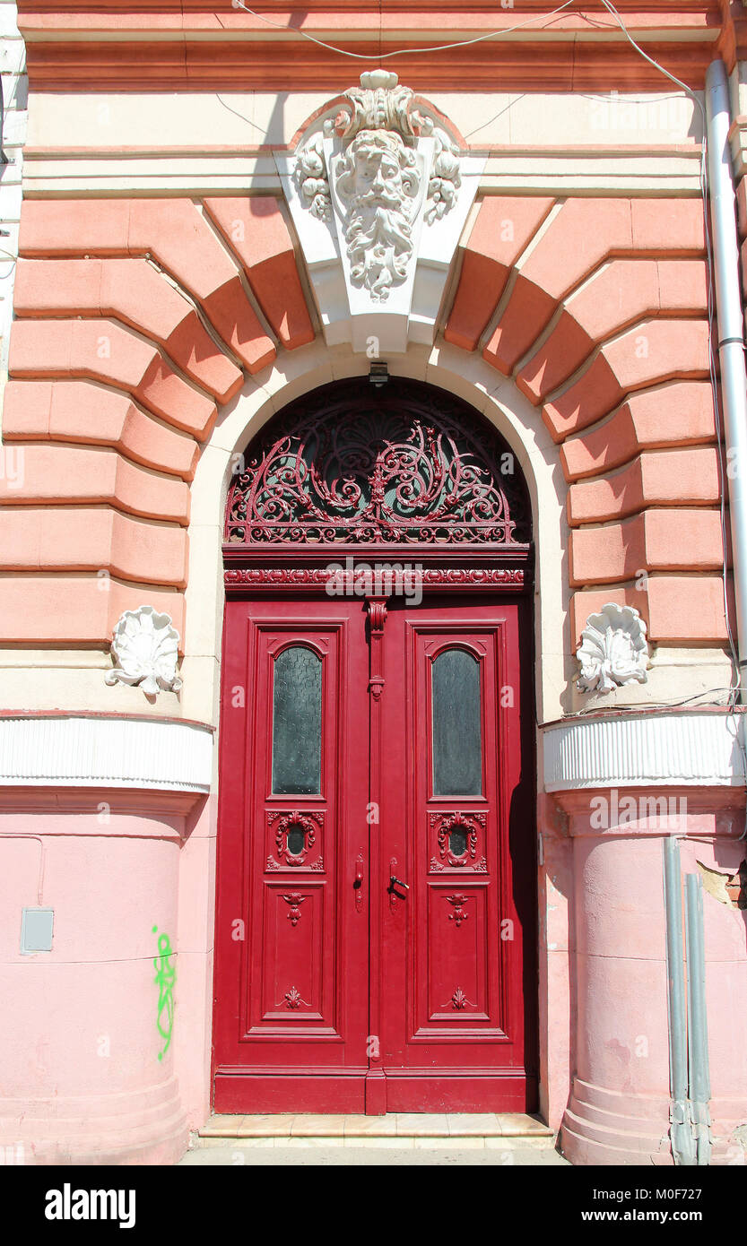 Brasov, town in Transylvania, Romania. Architectural feature - decorative wooden door. Stock Photo