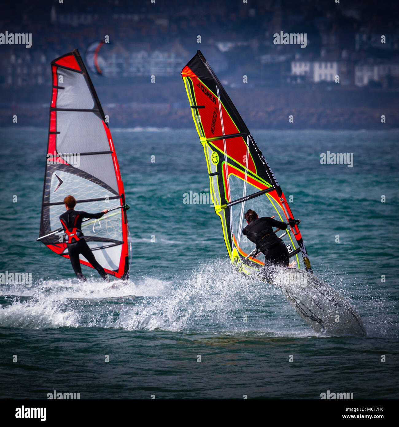 Wind surfing off the coast of Cornwall Stock Photo