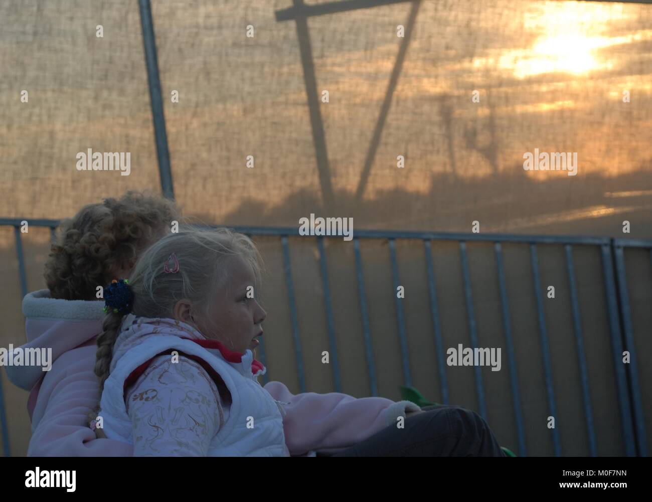 mother and child are waiting for the outdoor event to start Stock Photo