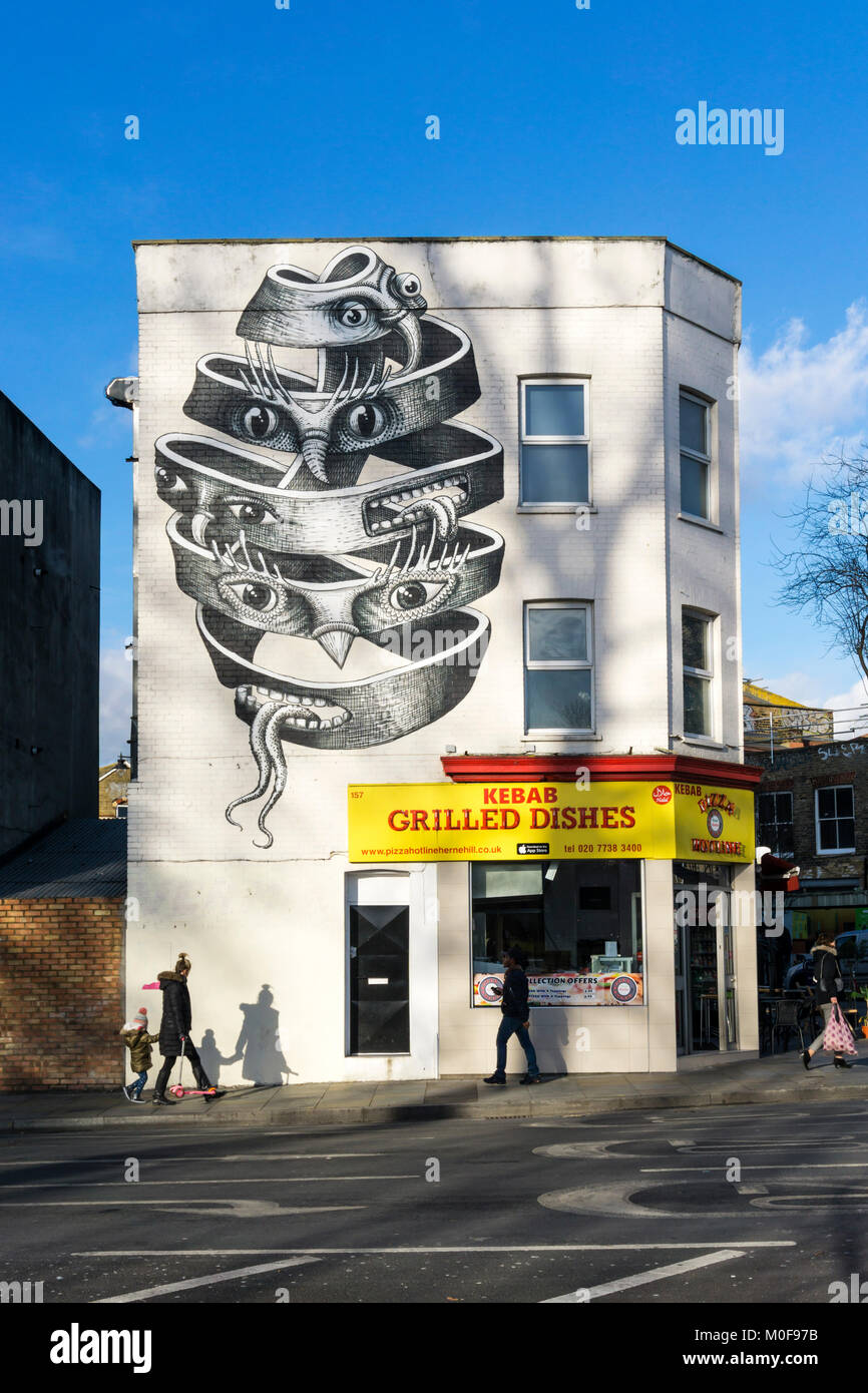 A kebab shop in Herne Hill features a Phlegm graffiti on its side wall. Stock Photo