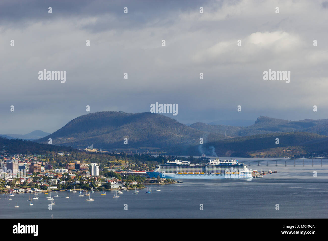 Hobart, Tasmania, Australia - 17 December 2017: Derwent estuary with cruise ship docking in Hobart harbour Stock Photo