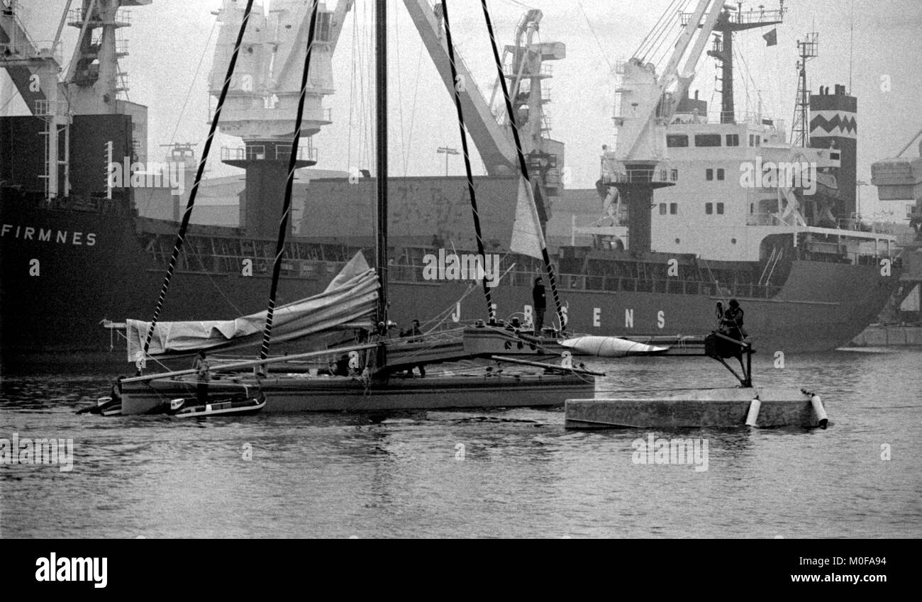 AJAXNETPHOTO. NOVEMBER, 1982. ST.MALO, FRANCE. - ROUTE DU RHUM RACE - GILLES OLLIERS DESIGNED PACIFIC PROA ROSIERES SKIPPERED BY GUY DELAGE (FR) LEAVING BASSIN VAUBIN. VESSEL COLLAPSED FROM STRUCTURAL FAILURE SHORTLY AFTER THE START. PHOTO:JONATHAN EASTLAND/AJAX REF:821007 F3089 Stock Photo