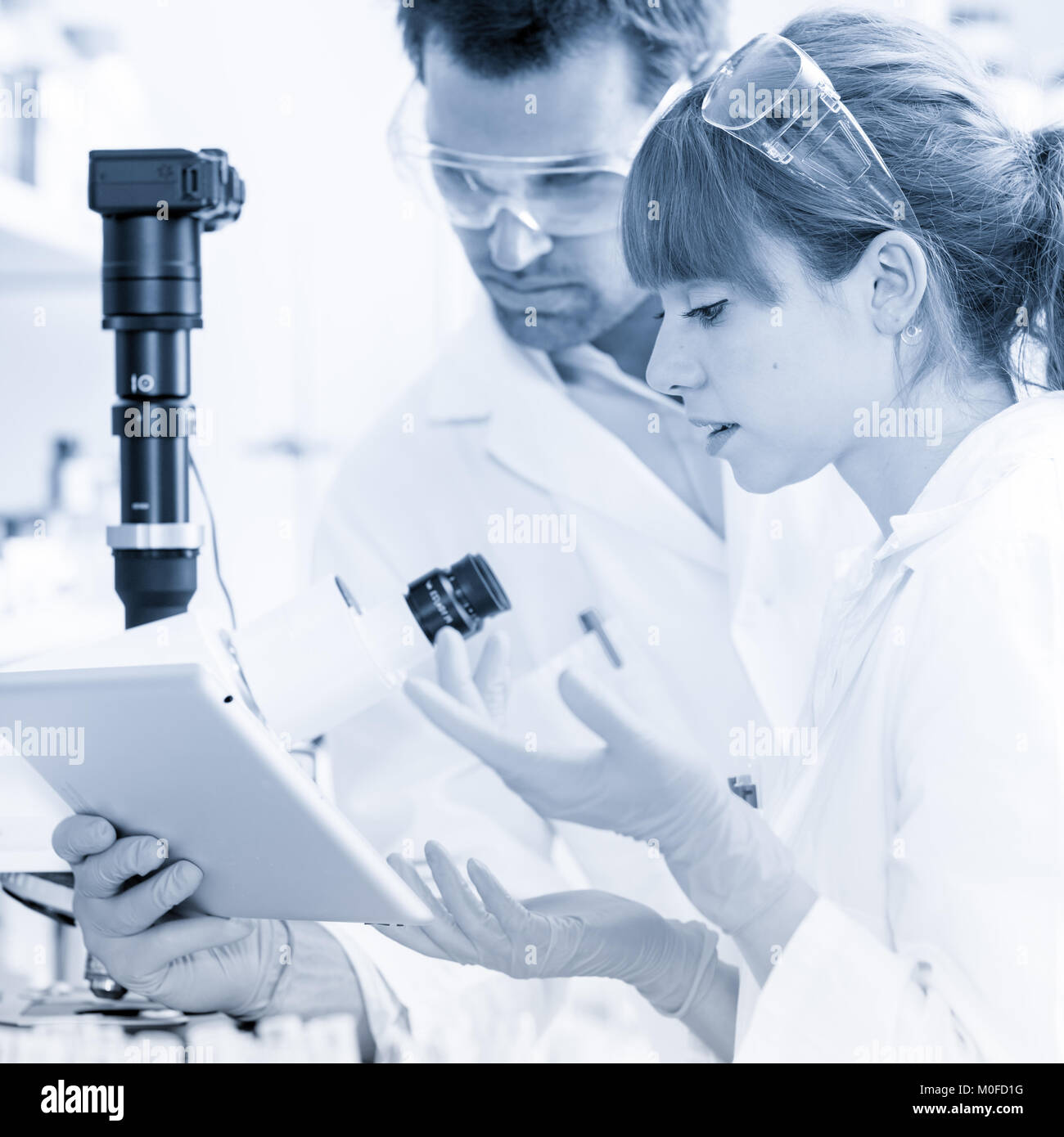 Health care researchers working in scientific laboratory Stock Photo ...