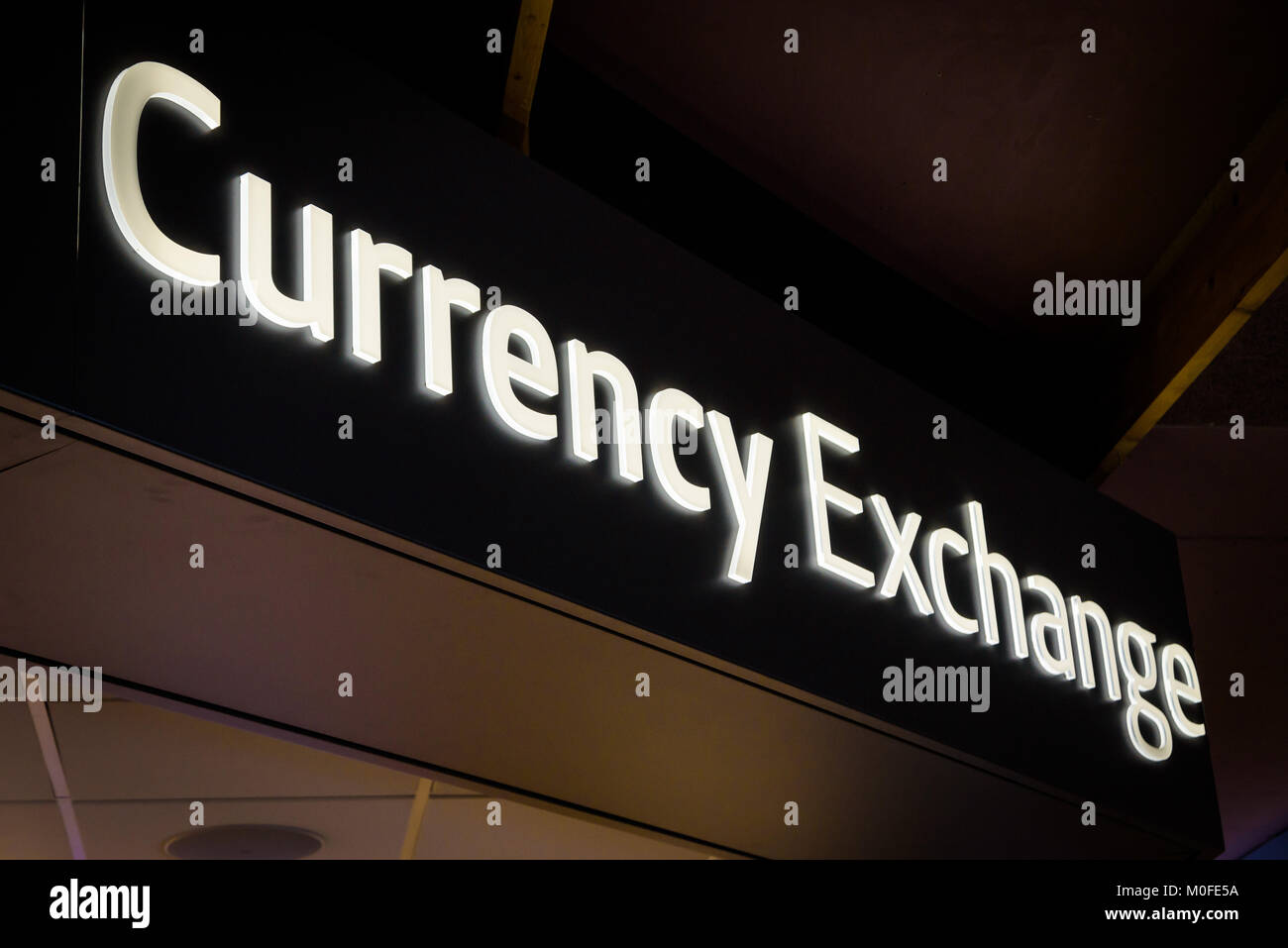 Currency exchange sign inside airport terminal Stock Photo