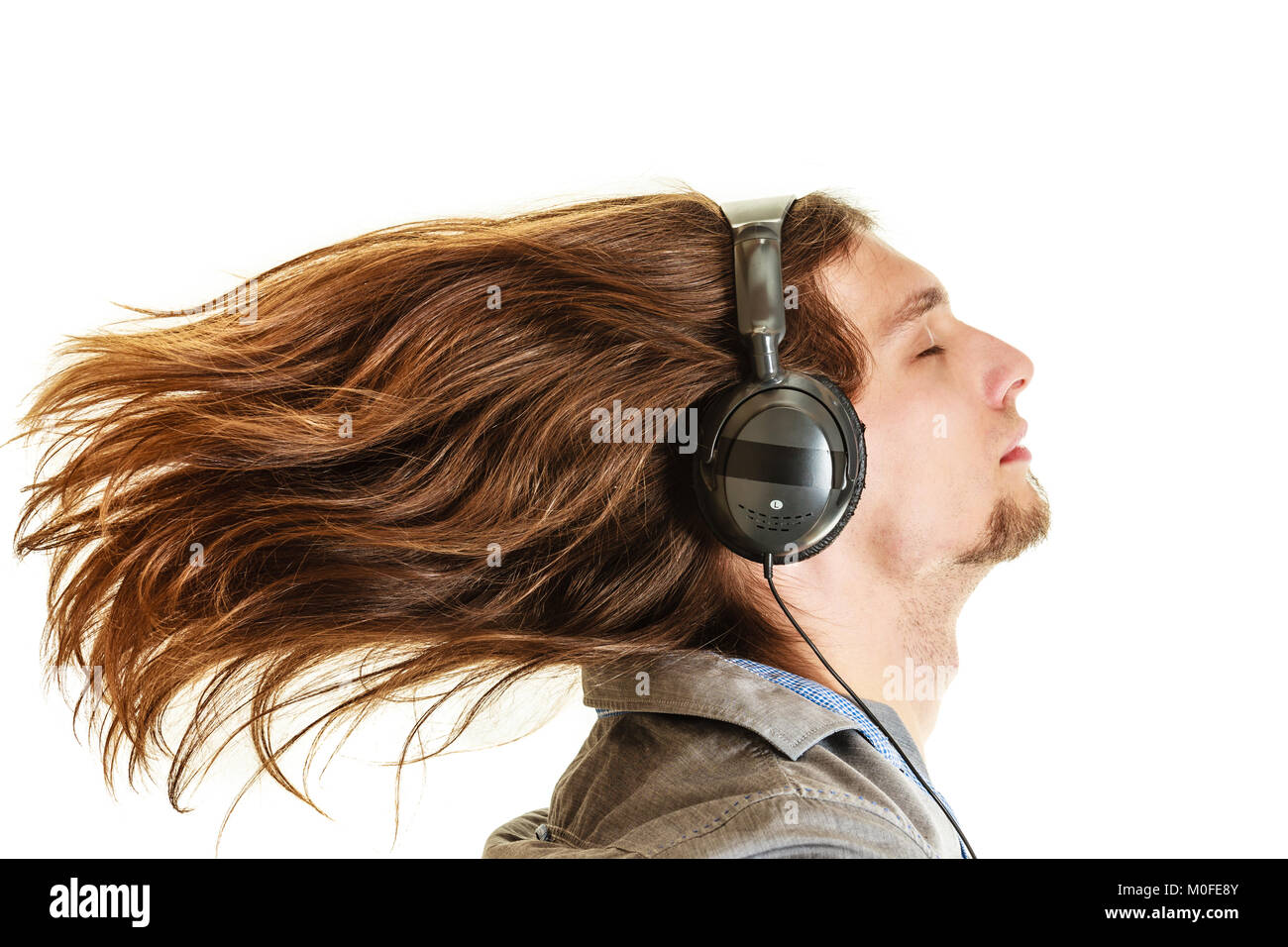 Passionate Music Lover With Long Hair Flying Young Man Listening