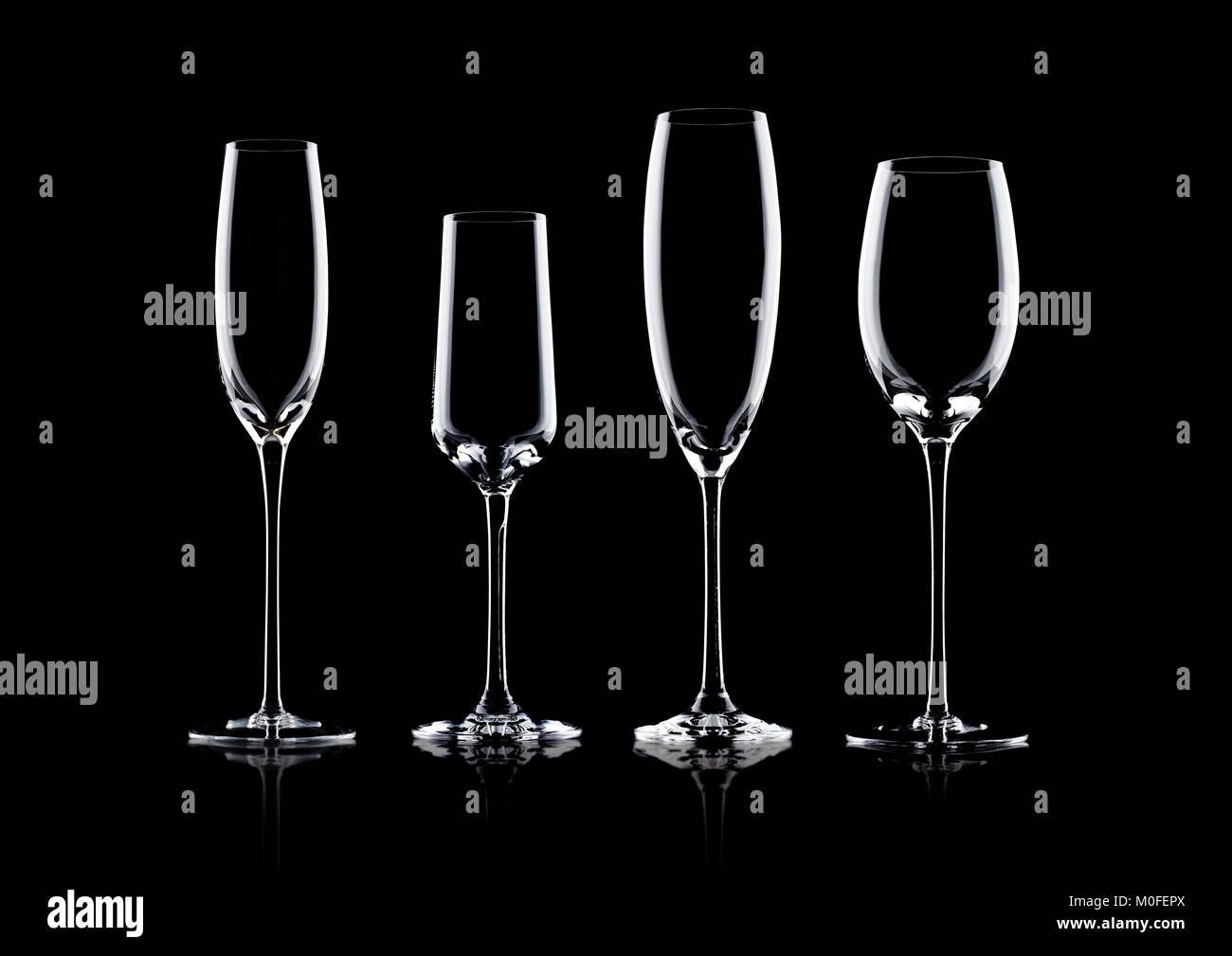 Empty champagne glasses on black background with reflection Stock Photo
