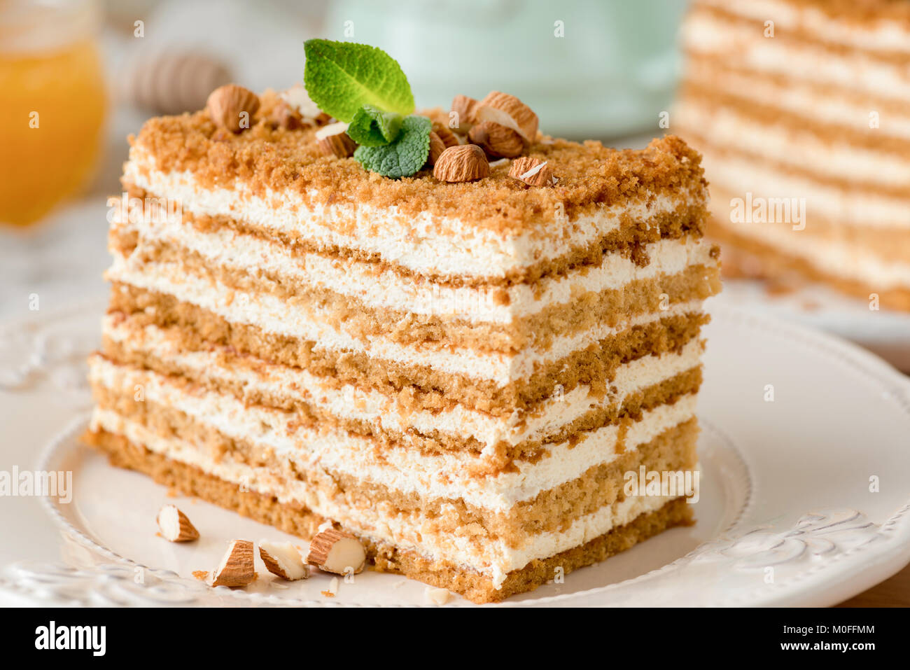 Honey cake Medovik on white plate. Layered honey cake. Closeup view Stock Photo