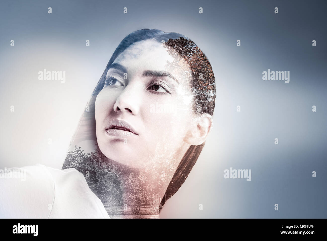 Dreamy brunette girl looking aside Stock Photo