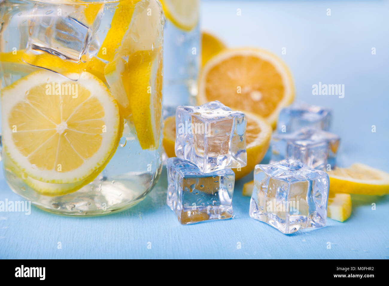 Refreshing ice cold water with lemon ready to drink. Concept of diet ...