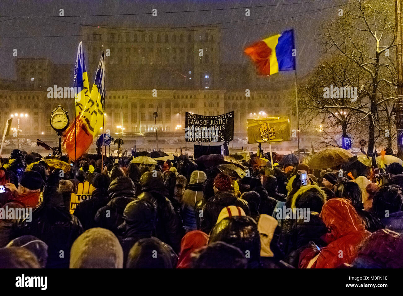 Demonstrators during an anti-corruption protest in front of the Romanian Parliament building in Bucharest Stock Photo