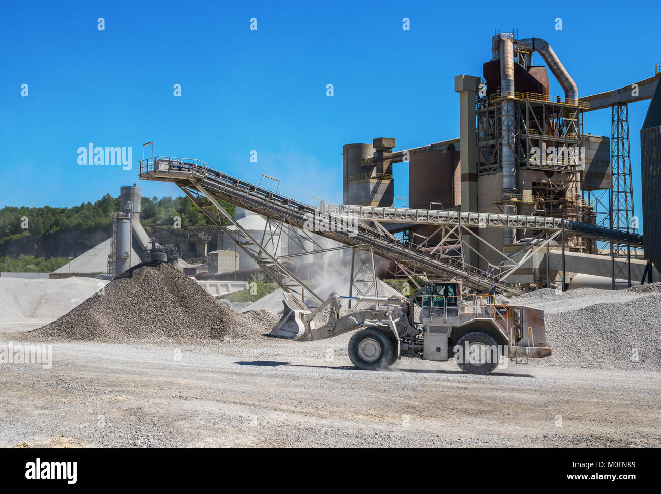 Caterpillar wheel loader driving to the brick factory at the Mount Saint Peter ENCI (First Dutch Cement Industry) quarry, Maastricht, The Netherlands. Stock Photo