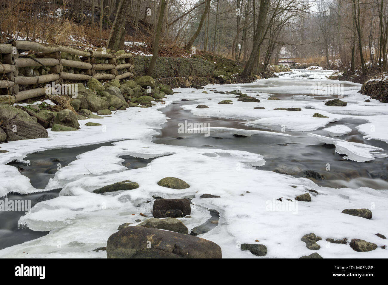Small Creek In Winter Ice And Snow Stock Photo