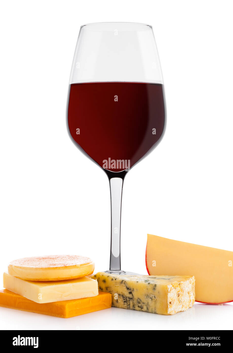 Glass of red wine with cheese selection and grapes on white background Stock Photo