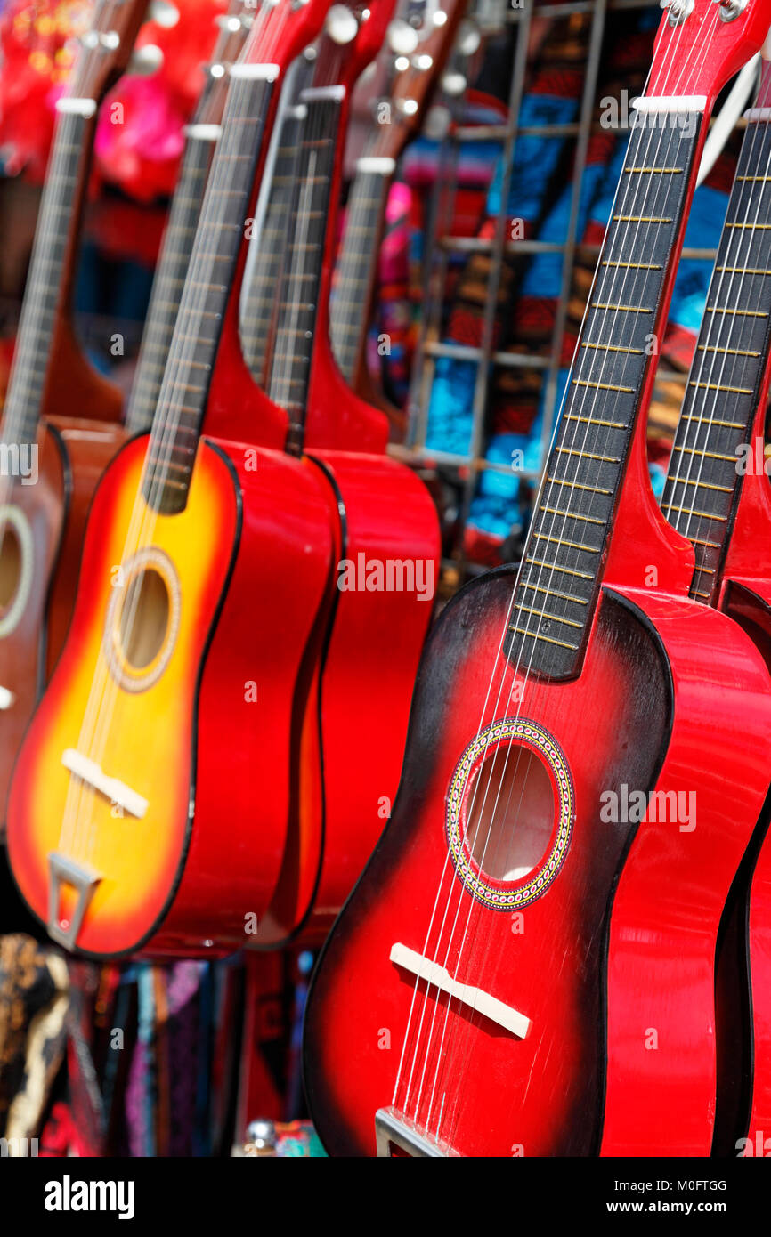 Red guitars for sale at a festival. Stock Photo