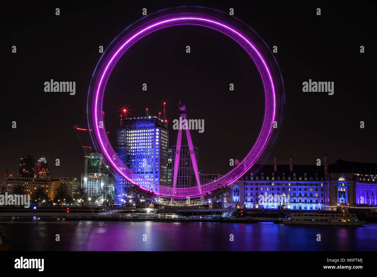 A slow exposure of the London Eye showing a light trail on January 17th 2018 in London, UK Stock Photo