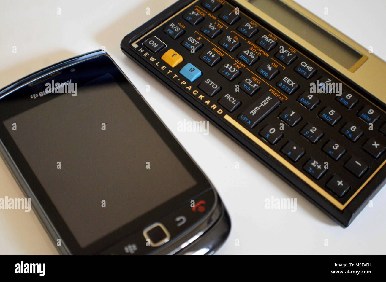Blackberry phone and HP calculator Stock Photo