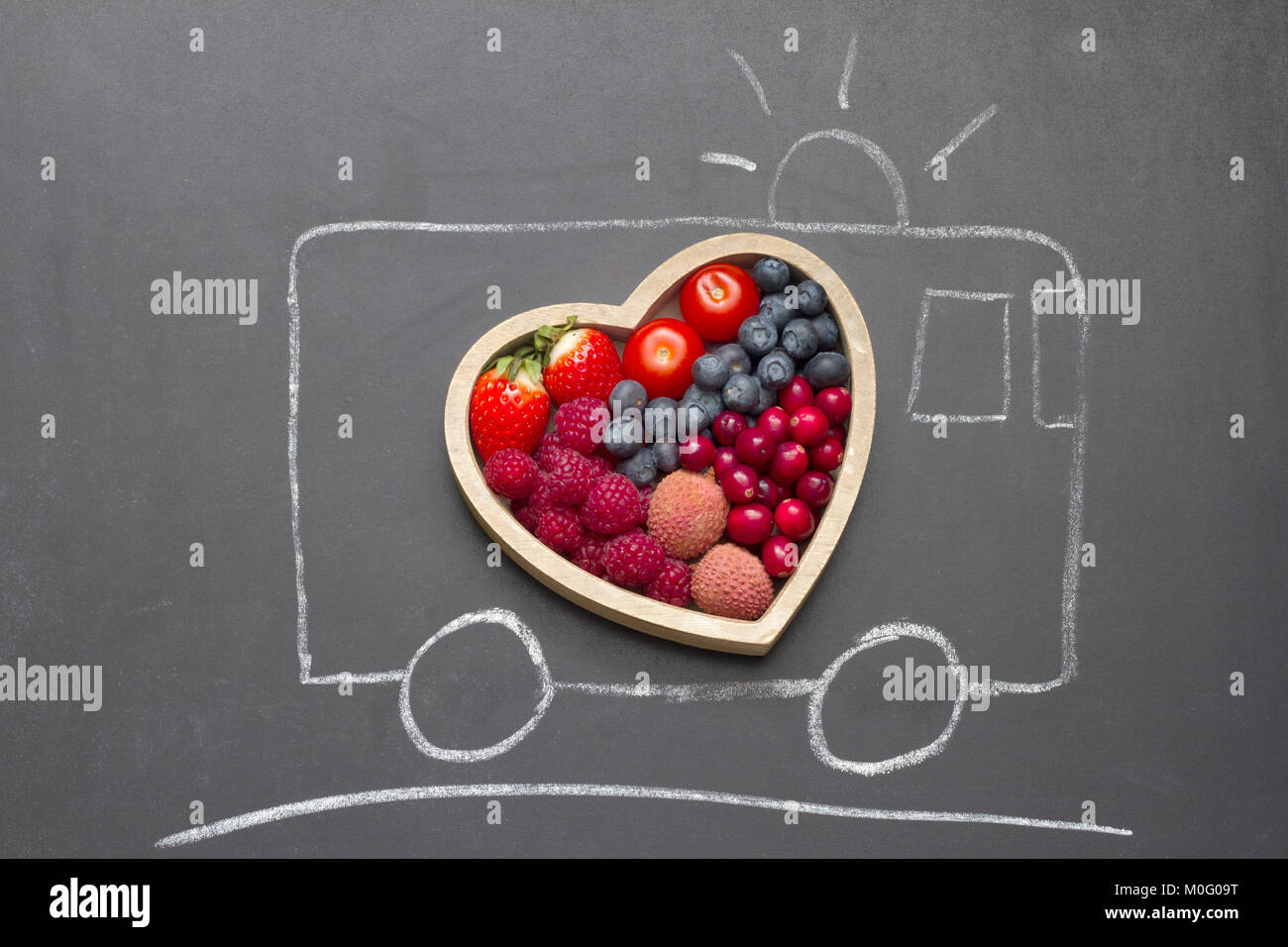 Health diet heart abstract concept with rescue ambulance on blackboard Stock Photo