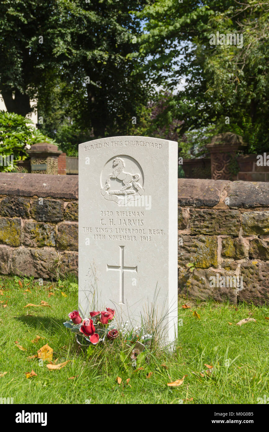 Commonwealth War Commission gravestone of Rifleman C.H Jarvis of the Kings Regiment in the graveyard of  St Peters church, Woolton, Liverpool. Stock Photo