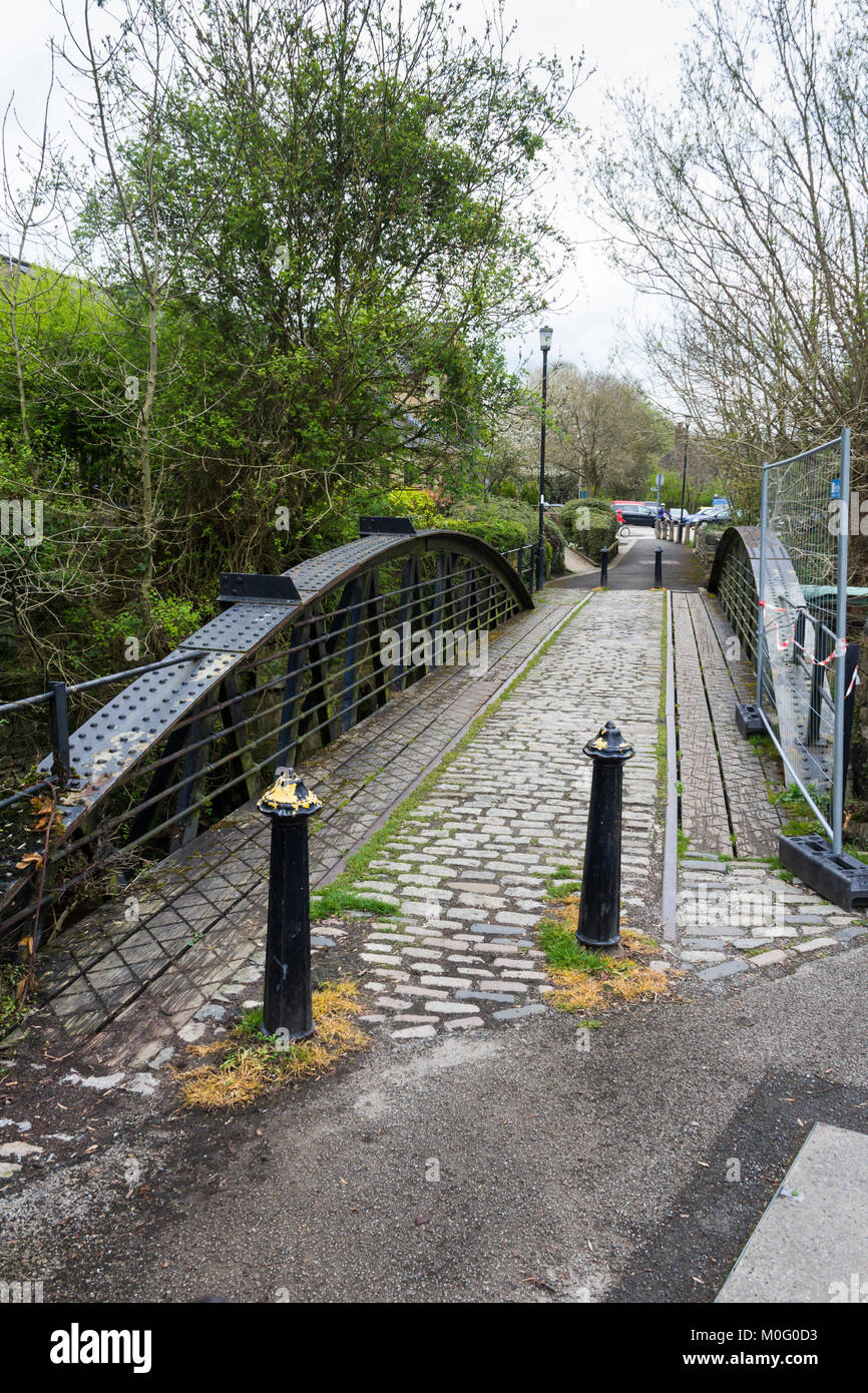 A footbridge over the River Goyt in Whaley Bridge, Derbyshire. The bridge formerly carried the Cromford and High Peak railway line. Stock Photo