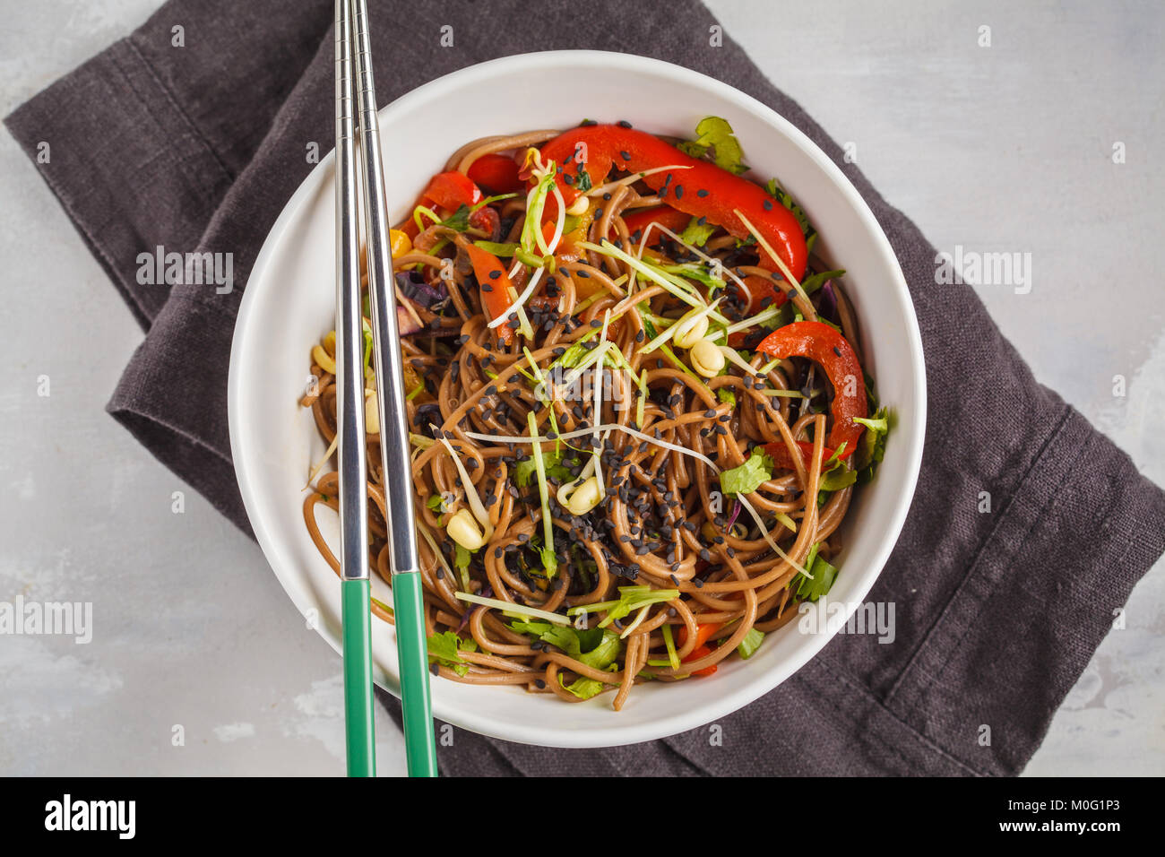 Healthy vegan buckwheat noodles with a mix of vegetables, sprouts and