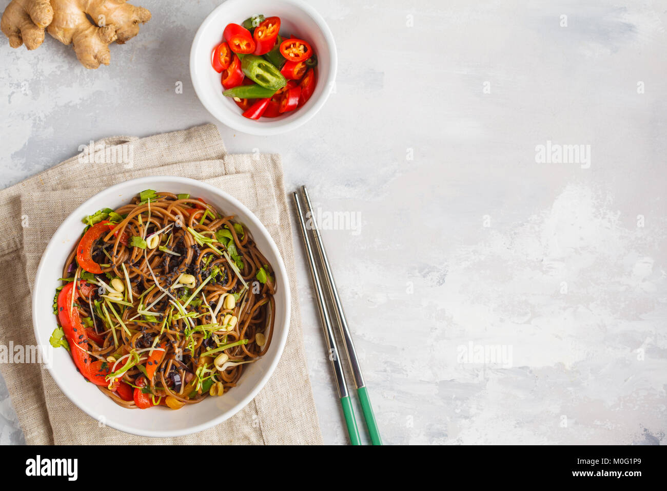 Healthy vegan buckwheat noodles with a mix of vegetables, sprouts and