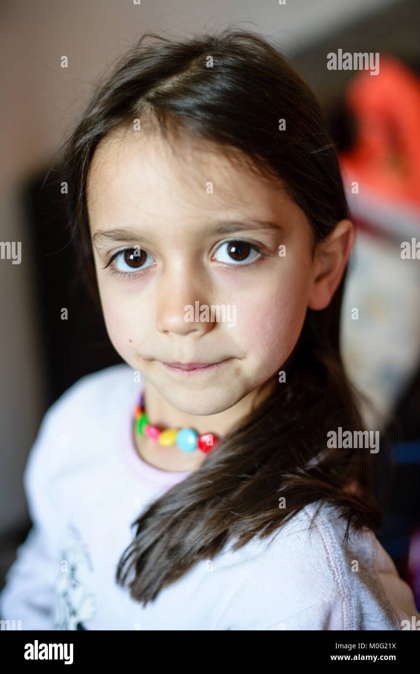 portrait-of-a-5-year-old-girl-wearing-pajamas-in-her-home-in-the-hall