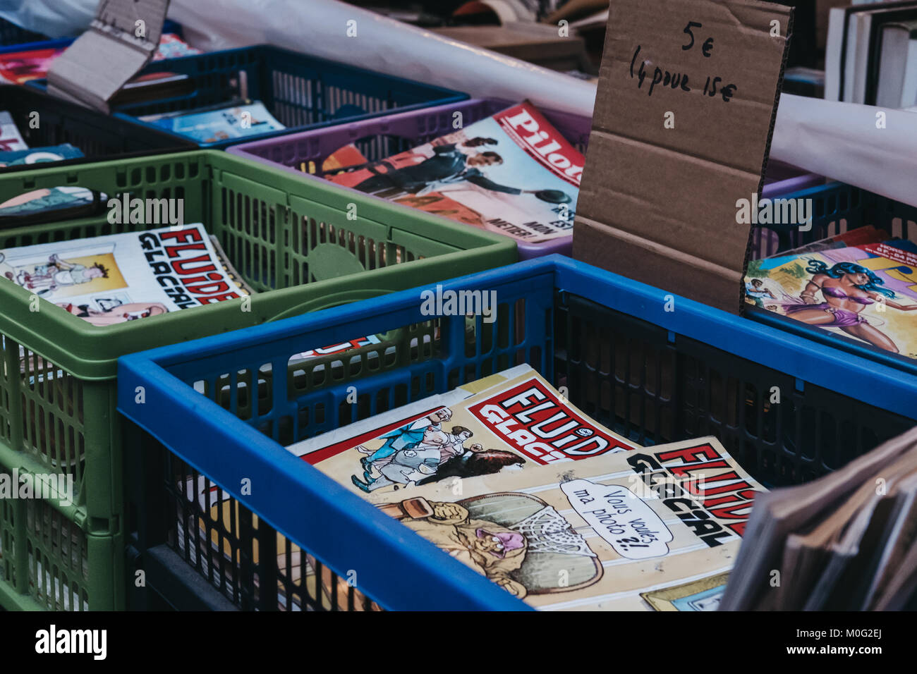 Comic books on sale at a second hand book market in the courtyard of the Vieille Bourse (old stock exchange) in Lille, France. Stock Photo