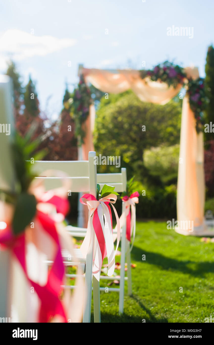Close Up Decoration With Pink Color Ribbons At Wedding Ceremony